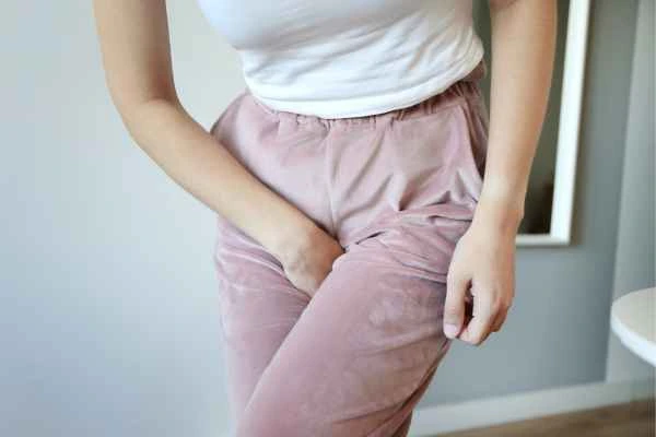 woman running for the toilet because of urinary incontinence Richmond upon Thames